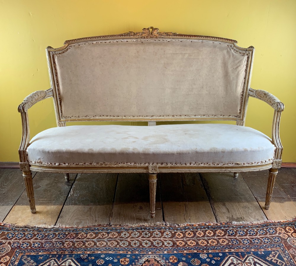 Antique French painted and gilt wood sofa in Louis XVI style
