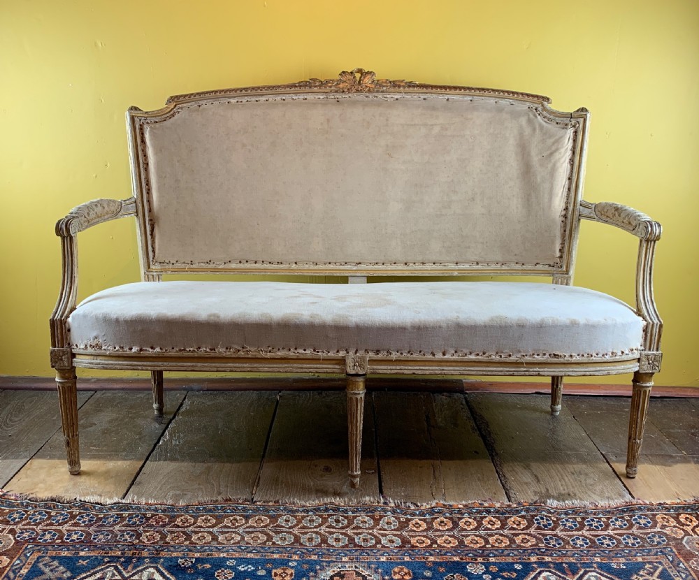 Antique French painted and gilt wood sofa in Louis XVI style View II