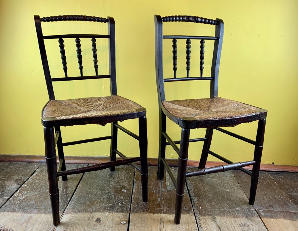 Pair of Regency faux bamboo rush seated chairs