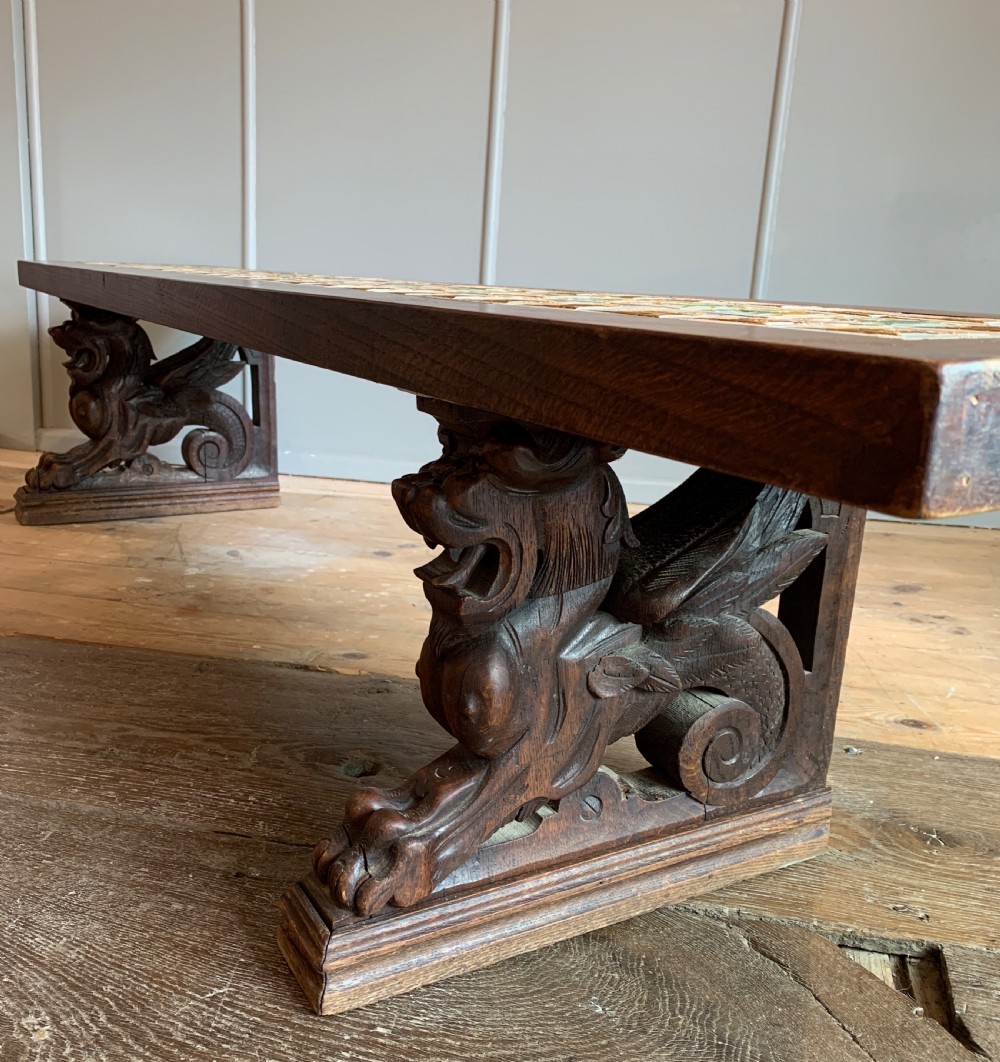 Unusual tile top bench with carved oak griffin supports View V