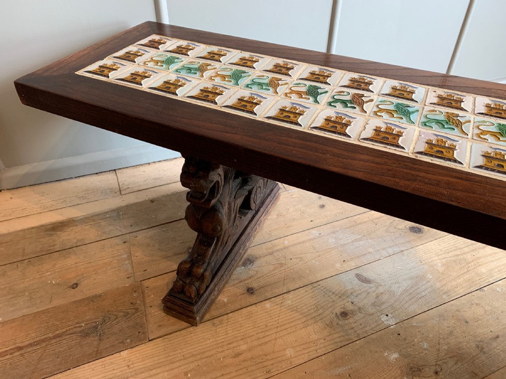 Unusual tile top bench with carved oak griffin supports View VII