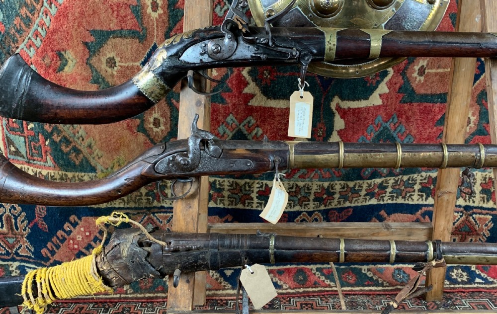 Display of antique Arabian jezail and matchlock guns and an Indian dahl View III