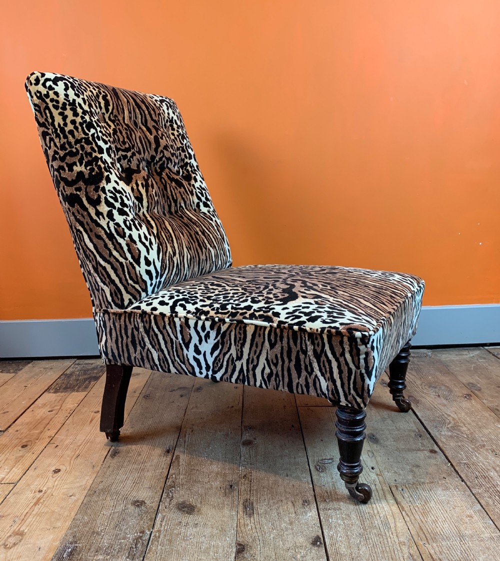 Antique button back occasional chair re-upholstered in leopard print velvet