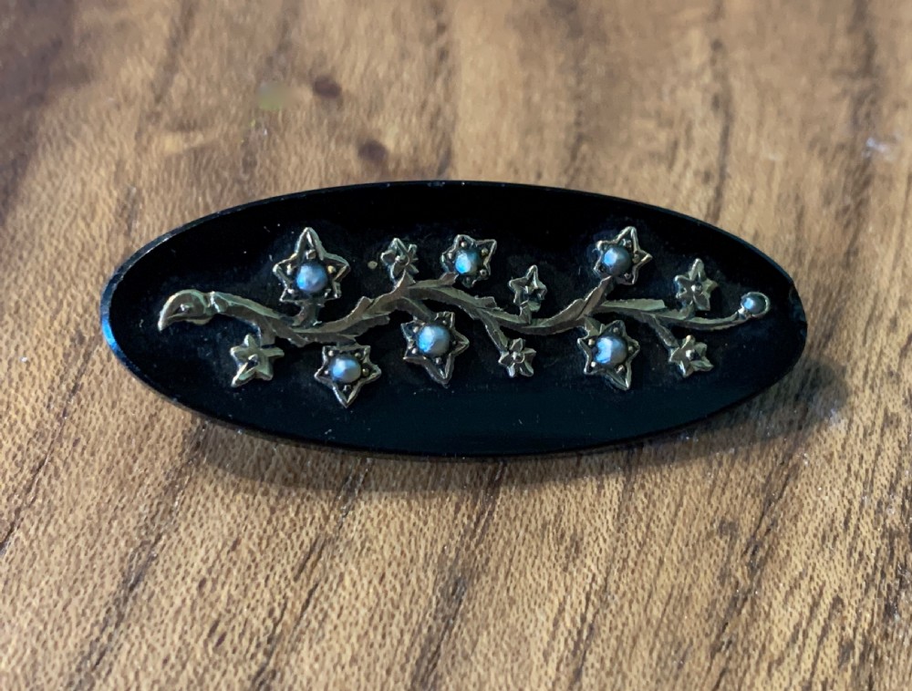 Victorian onyx brooch with a seed pearl set gold branch View IV