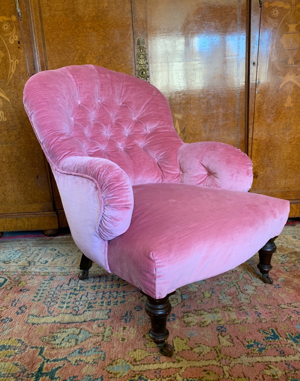 Victorian iron frame button back armchair recently upholstered in pink velvet 