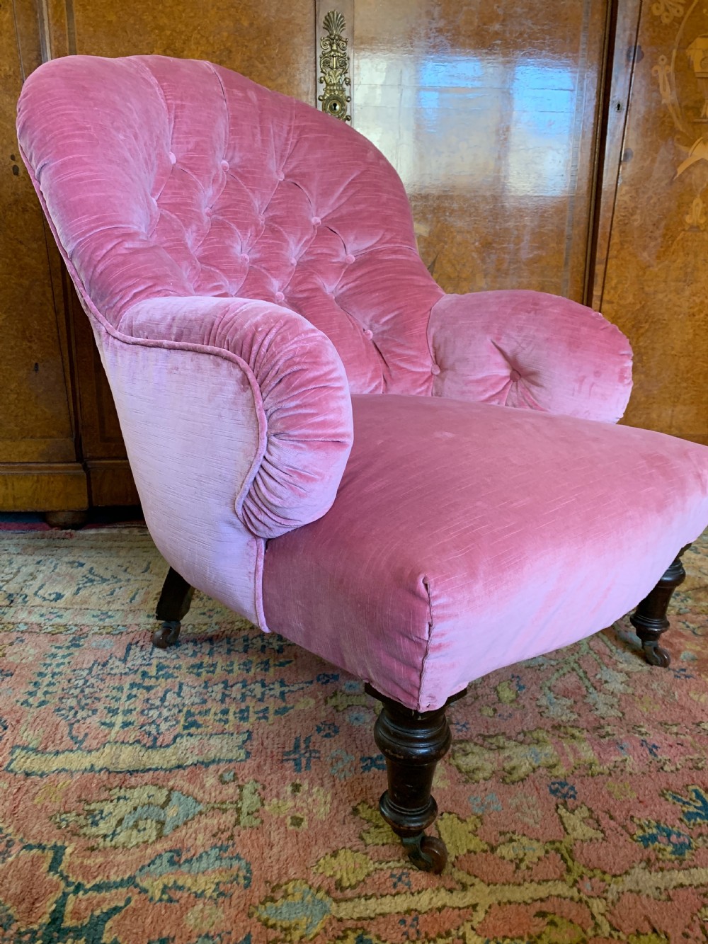 Victorian iron frame button back armchair recently upholstered in pink velvet  View II