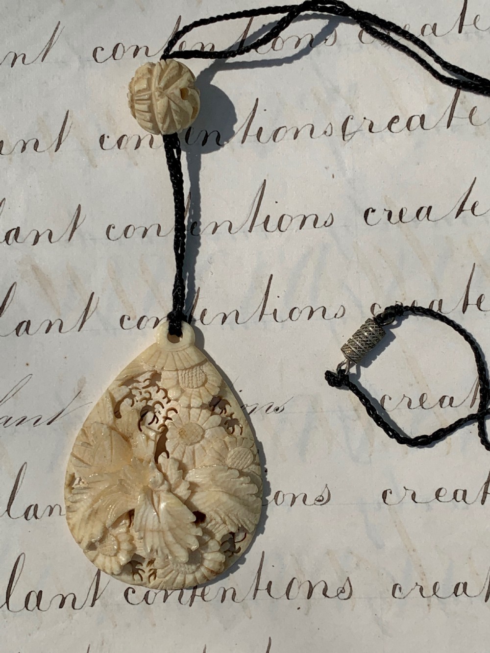 Antique carved stag horn pendant necklace with foliate decoration View II