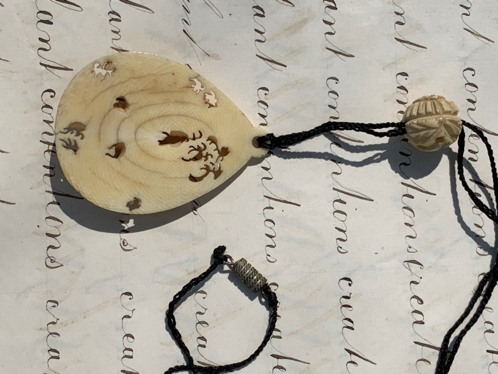 Antique carved stag horn pendant necklace with foliate decoration View III