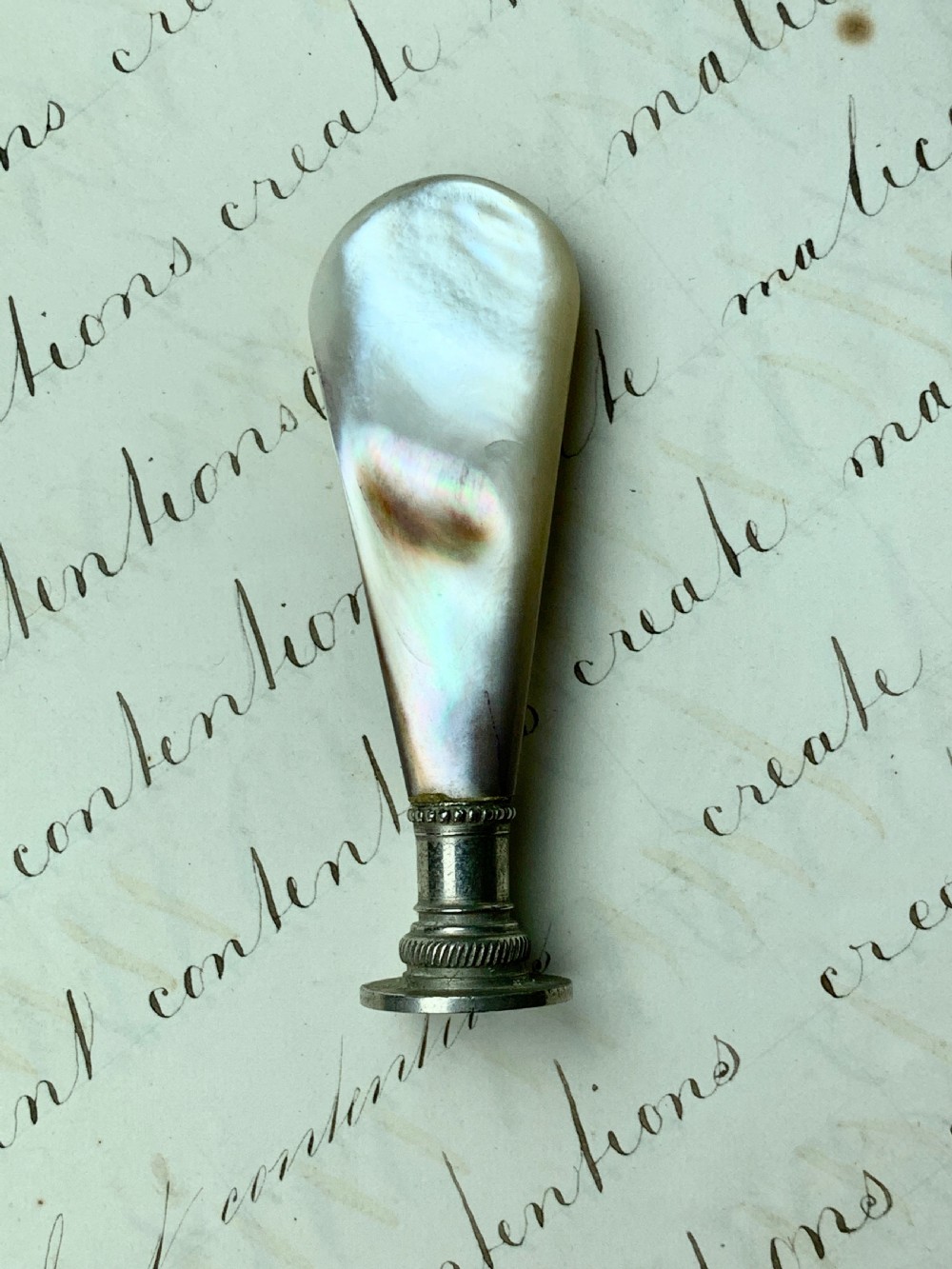 Antique Victorian pipe tamper with mother of pearl handle