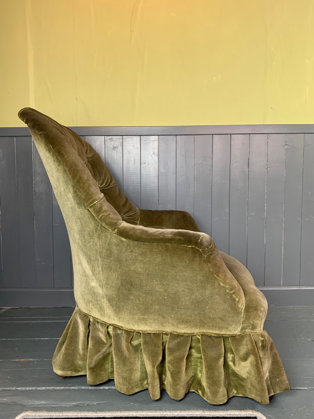 Victorian iron framed button back armchair with green velvet upholstery View III