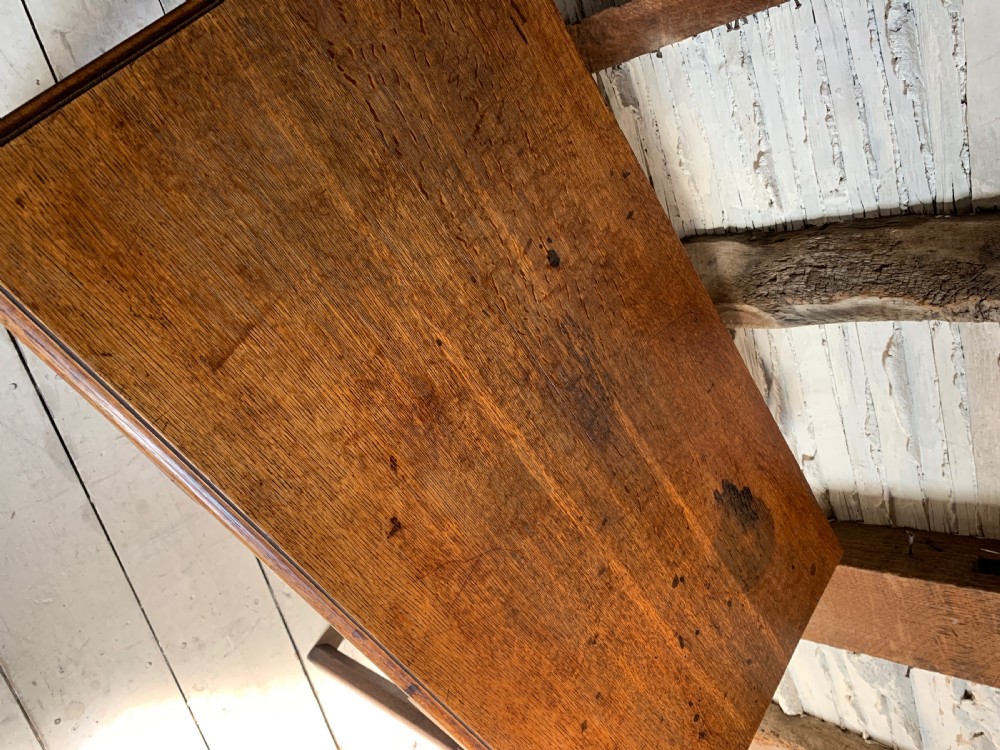 Georgian oak lowboy with three frieze drawers and pierced brass handles View VI
