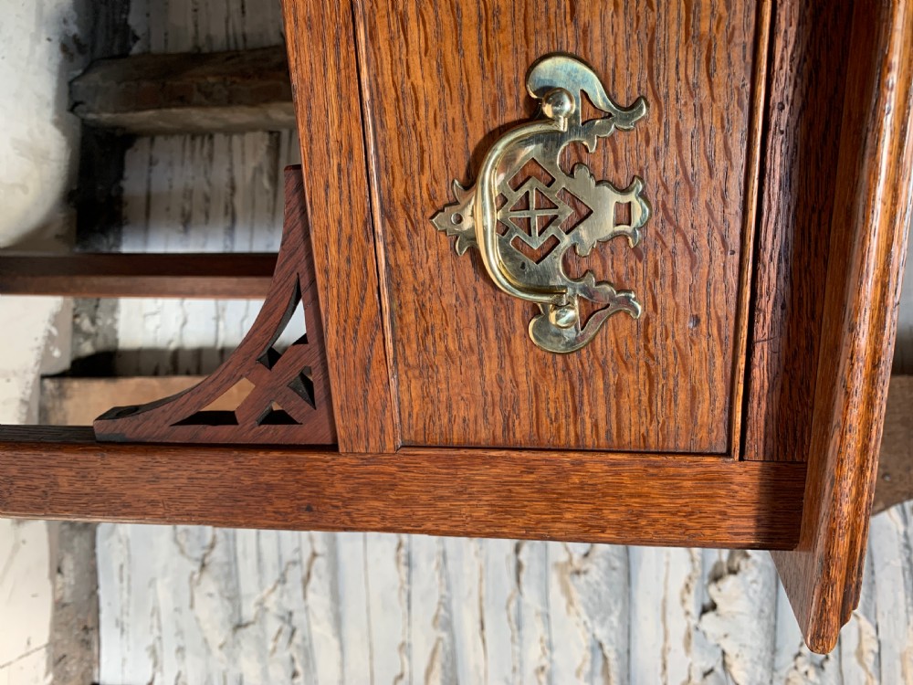 Georgian oak lowboy with three frieze drawers and pierced brass handles View VIII