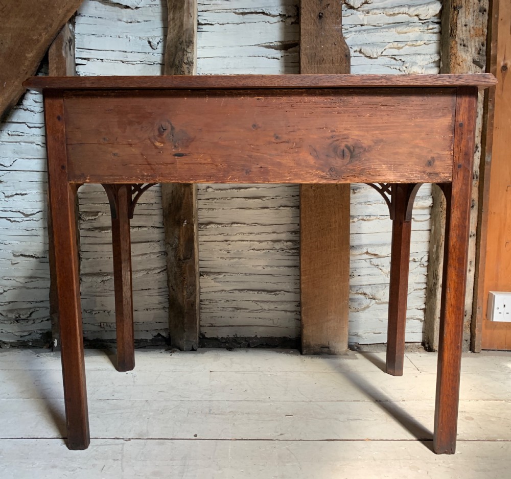 Georgian oak lowboy with three frieze drawers and pierced brass handles View X
