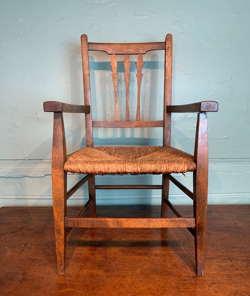 Antique rush seated child's chair in Arts & Crafts style View III