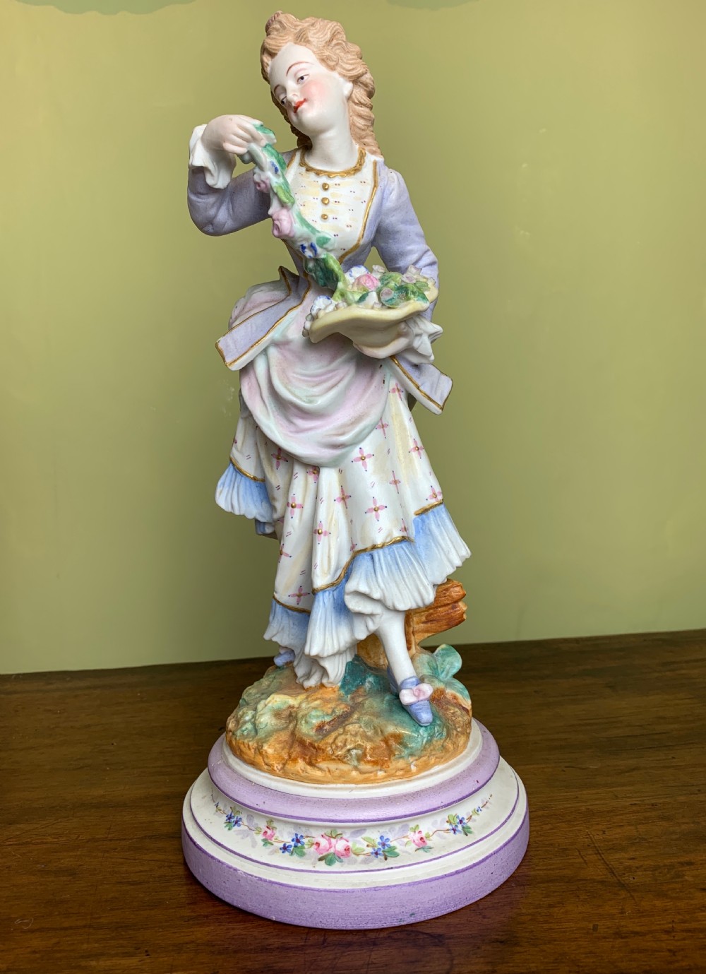 Pair of French bisque porcelain figures with baskets of flowers View IV