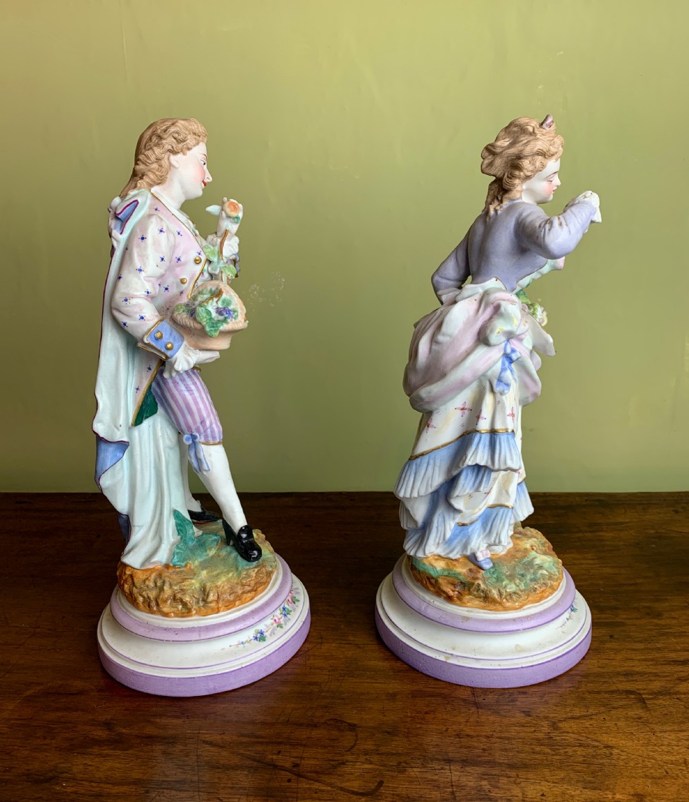 Pair of French bisque porcelain figures with baskets of flowers View VI