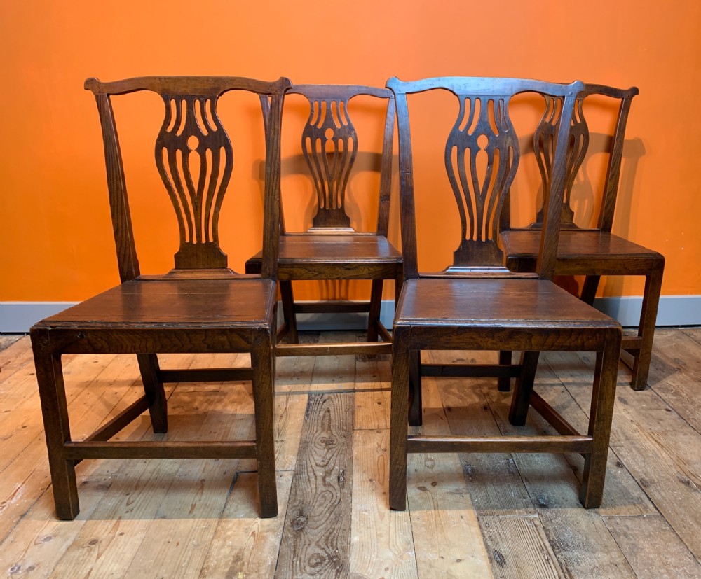 Set of four Georgian provincial oak dining chairs with solid seats View II