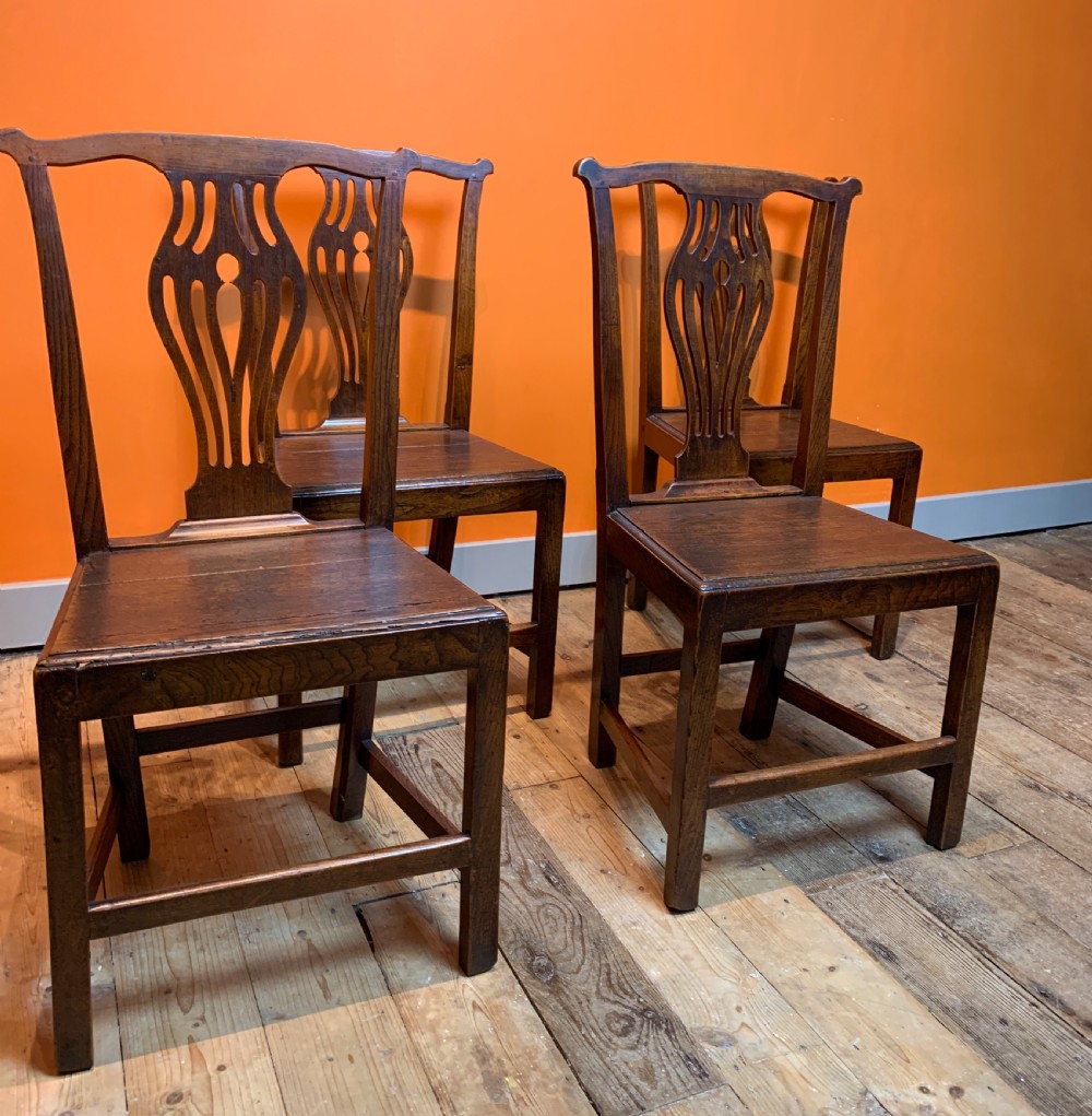 Set of four Georgian provincial oak dining chairs with solid seats View IV