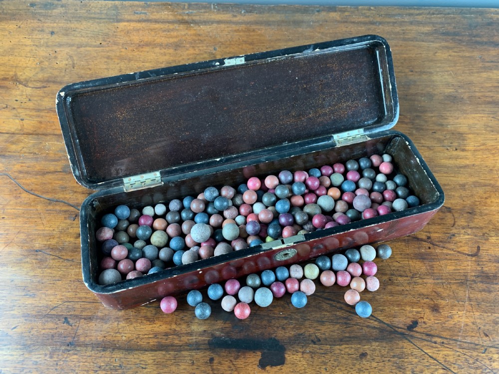Quantity of Victorian Pottery Marbles in a Japanese lacquer box