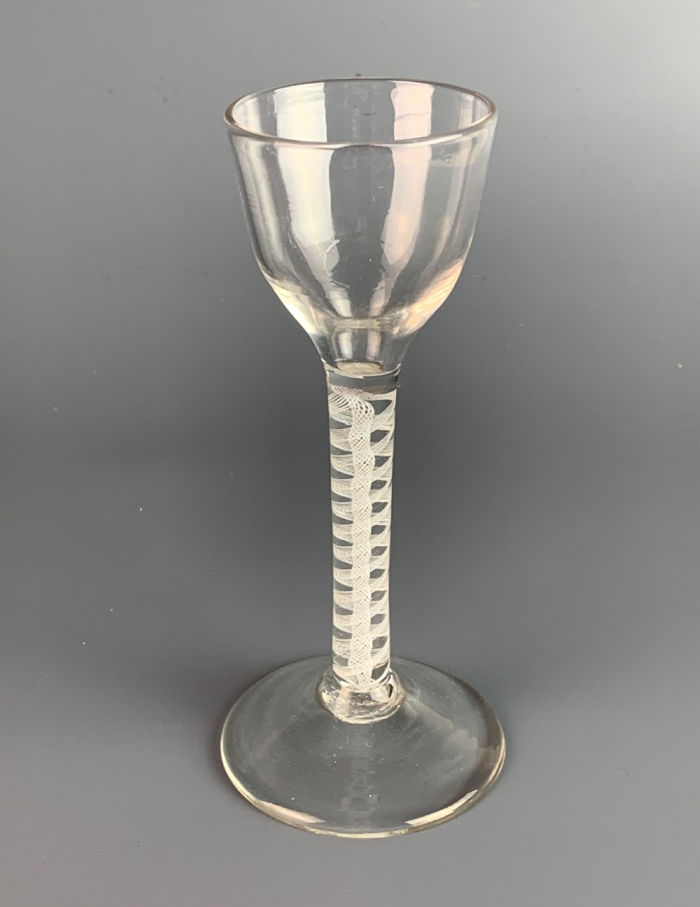 18th century cordial glass with double opaque spiral twist stem.