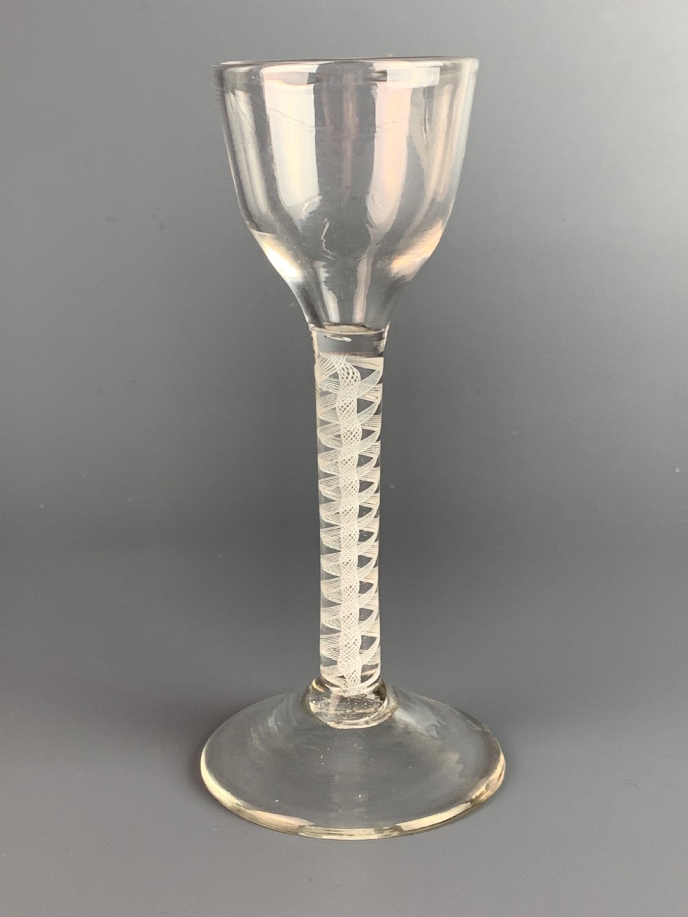 18th century cordial glass with double opaque spiral twist stem. View II