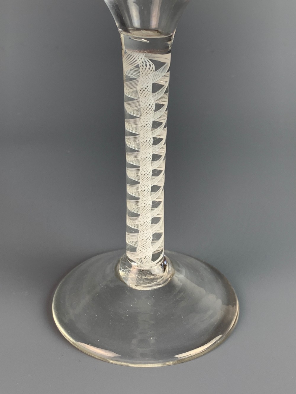 18th century cordial glass with double opaque spiral twist stem. View III