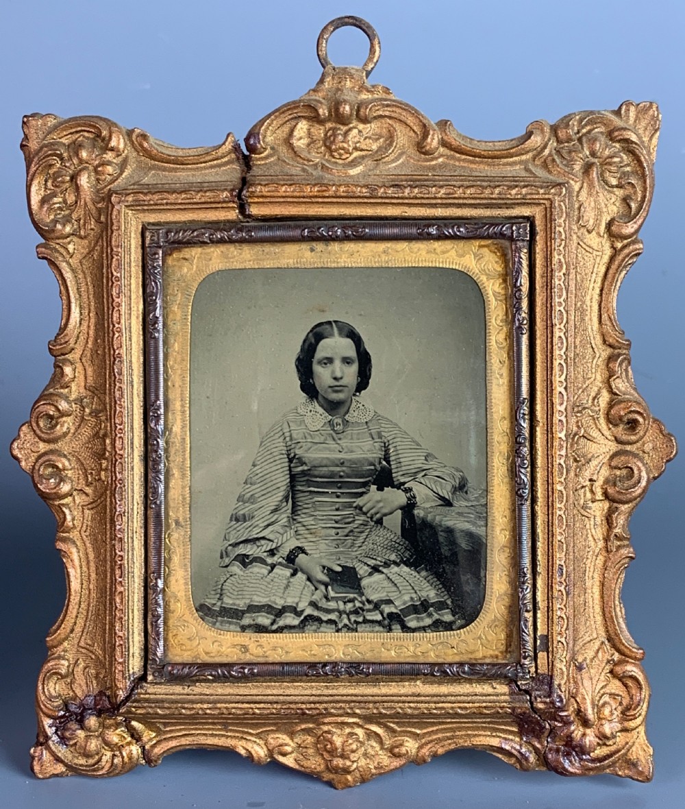 Victorian ambrotype of a young woman together with a hand-touched photograph of the same image View II