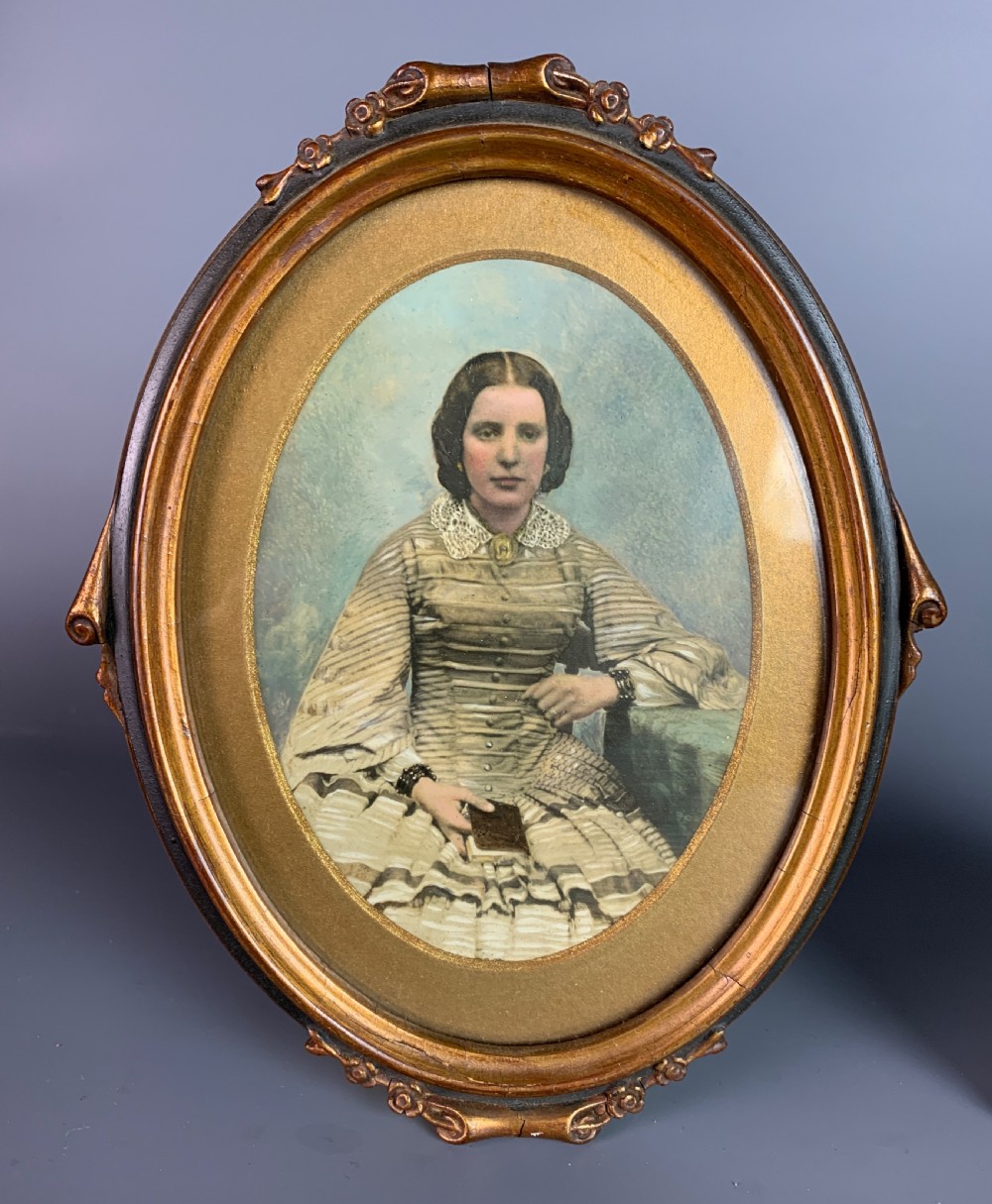 Victorian ambrotype of a young woman together with a hand-touched photograph of the same image View III