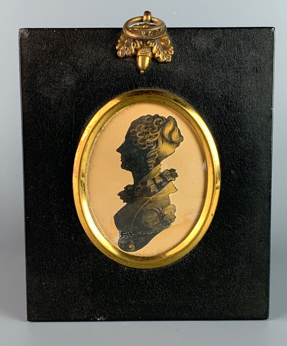 Regency cut silhouette of a lady with bronze highlights in a Wm Hill frame
