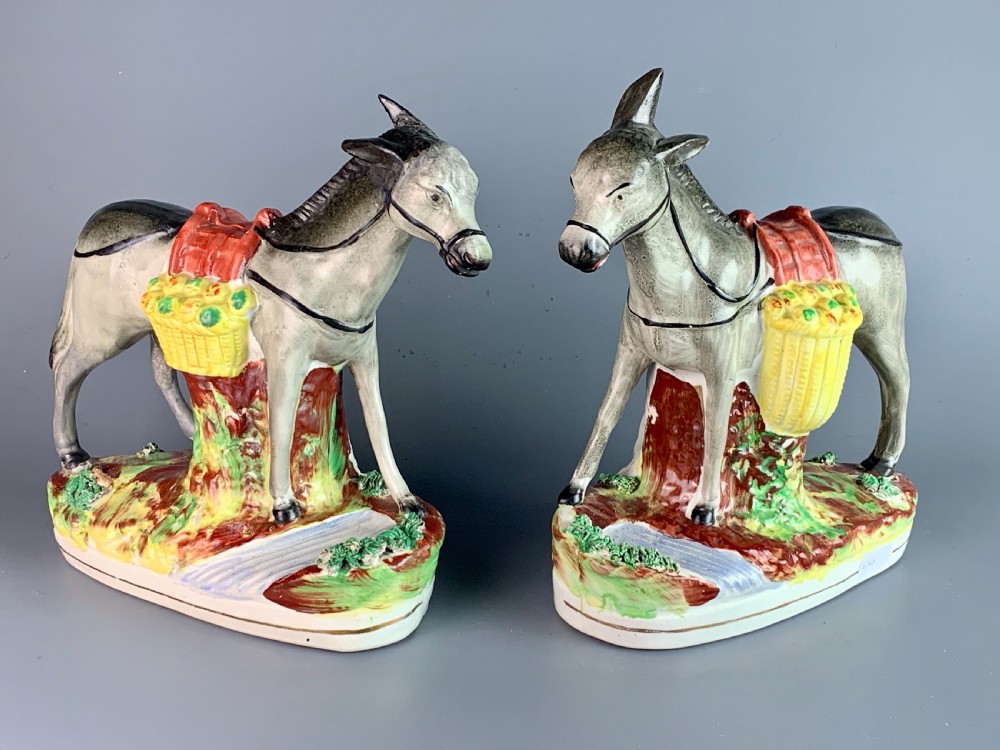 Pair of Victorian Staffordshire pottery donkeys carrying paneers View VI