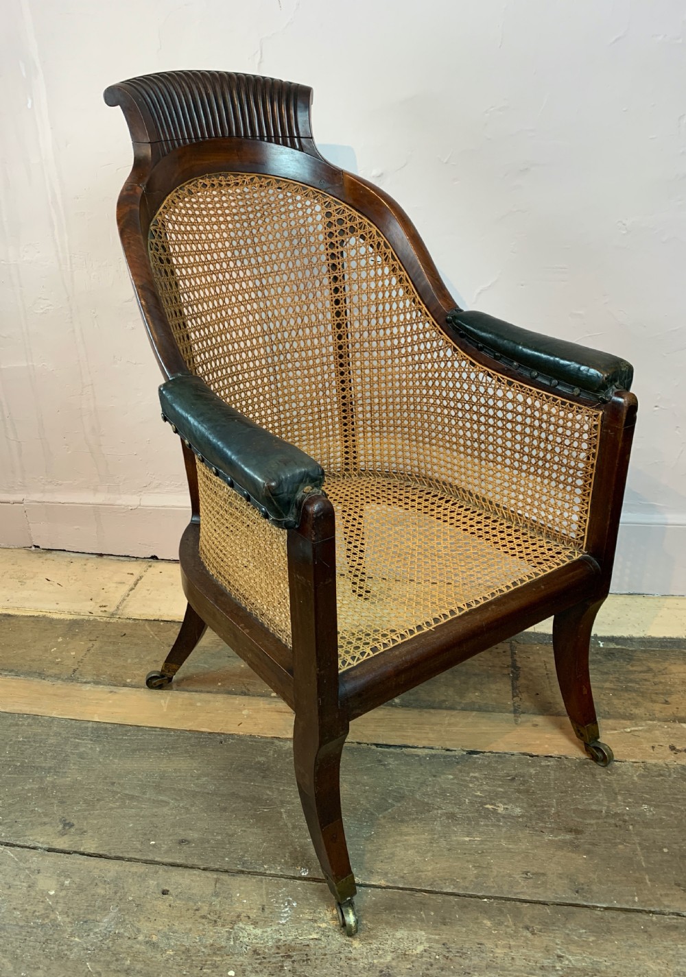 Regency mahogany bergere library armchair with loose leather cushion seat View III