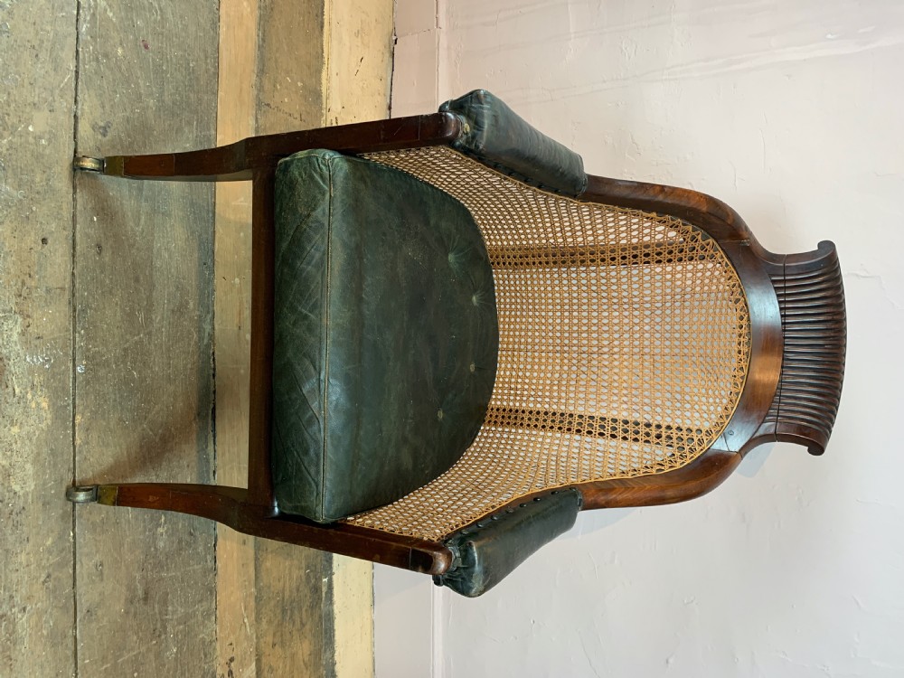 Regency mahogany bergere library armchair with loose leather cushion seat View IV