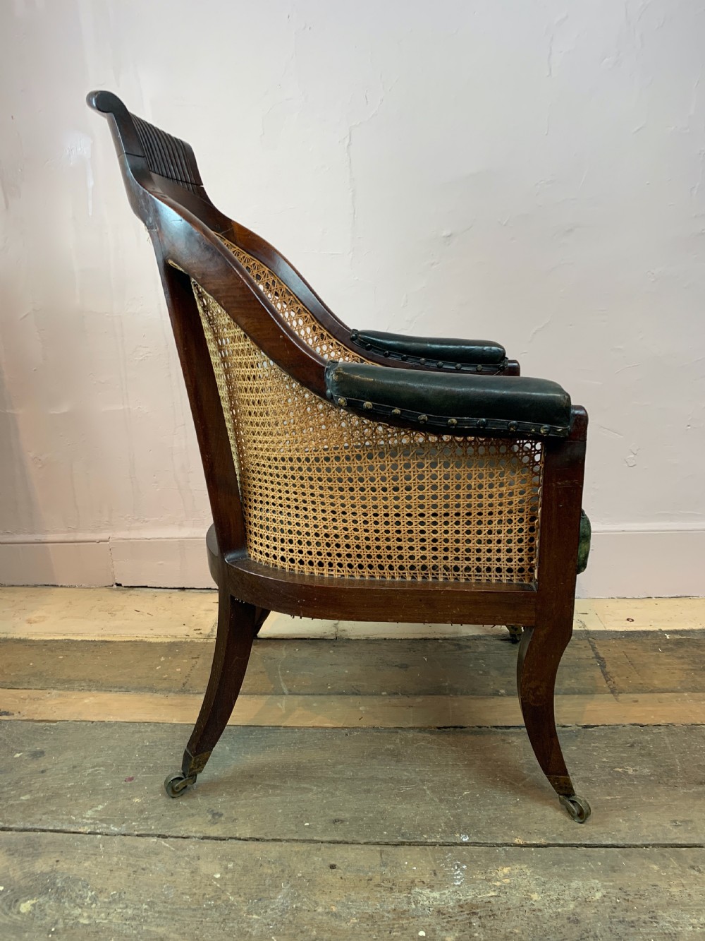 Regency mahogany bergere library armchair with loose leather cushion seat View VII