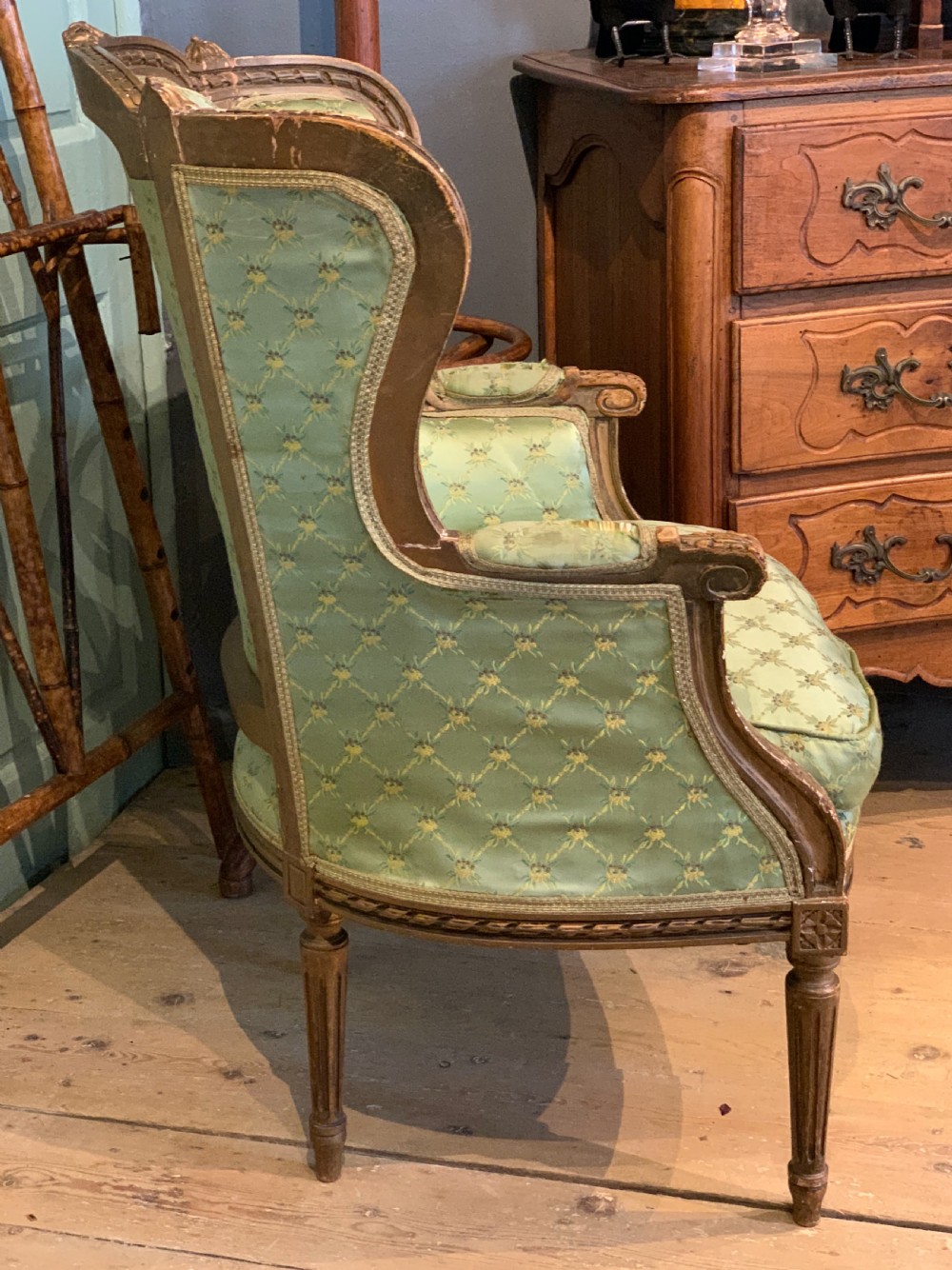 Antique French giltwood wing-back armchair in Louis XVI style View V