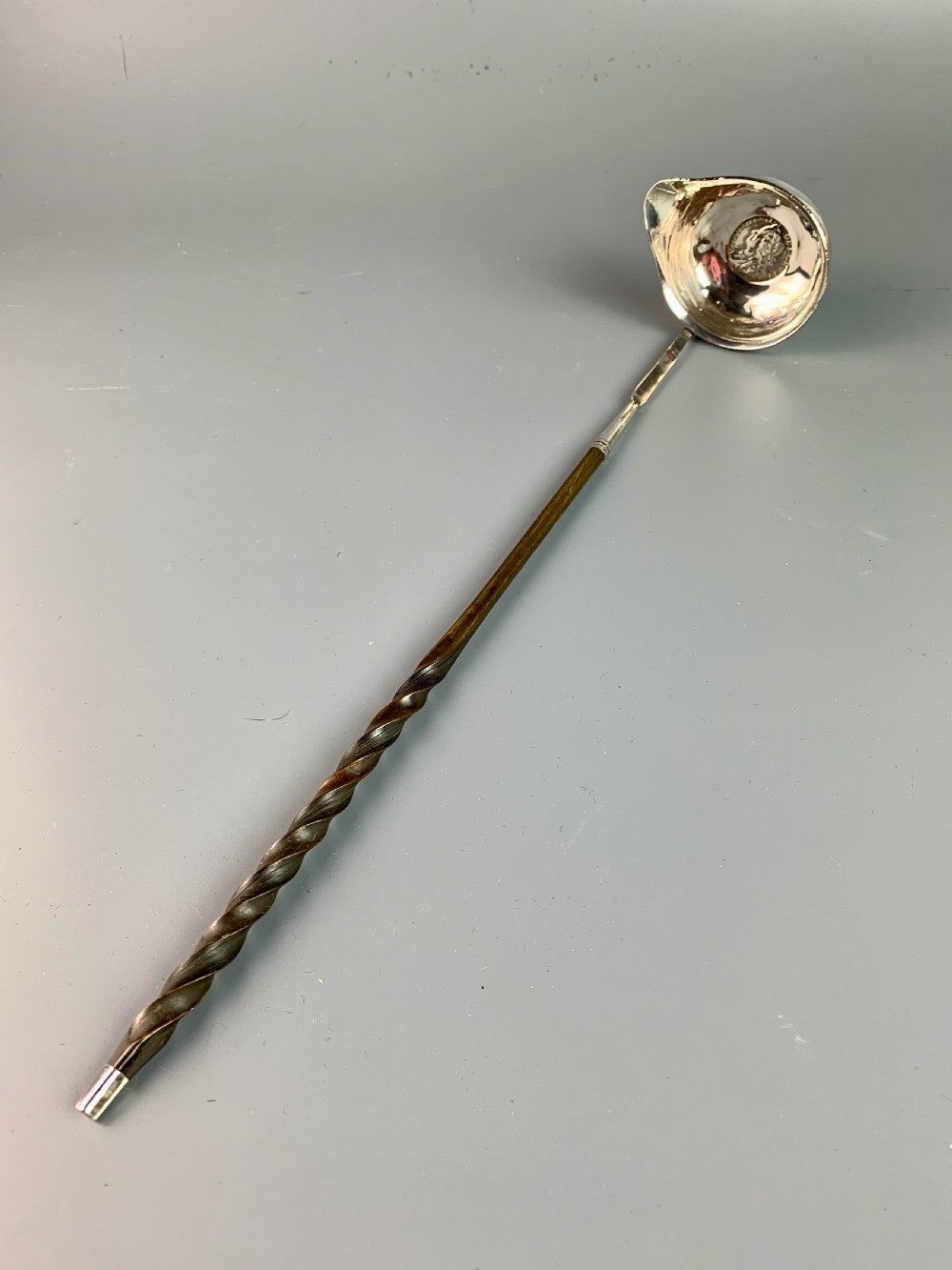 Georgian silver toddy ladle with coin bowl and twisted baleen handle