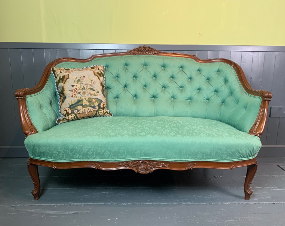 Antique French button back two seat sofa in Louis XV style