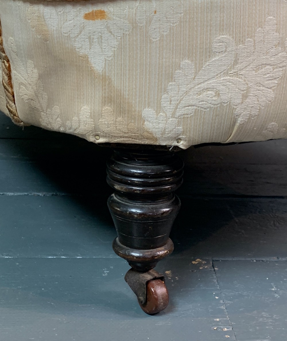 Deep seated Victorian button back armchair of country house proportions View II