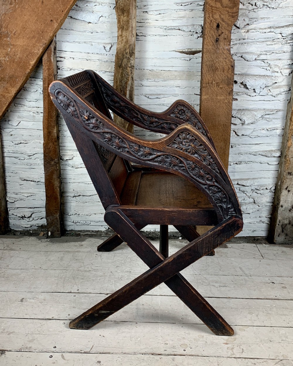 Victorian oak Glastonbury chair carved with the Crown of Thorns View II