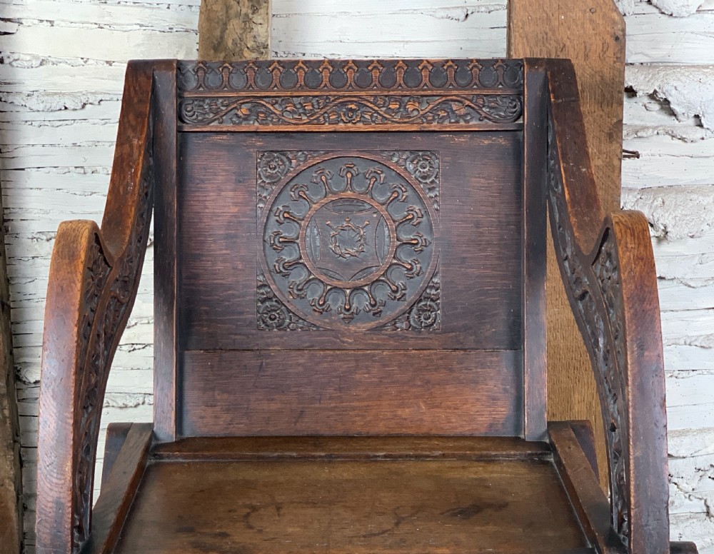 Victorian oak Glastonbury chair carved with the Crown of Thorns View VI