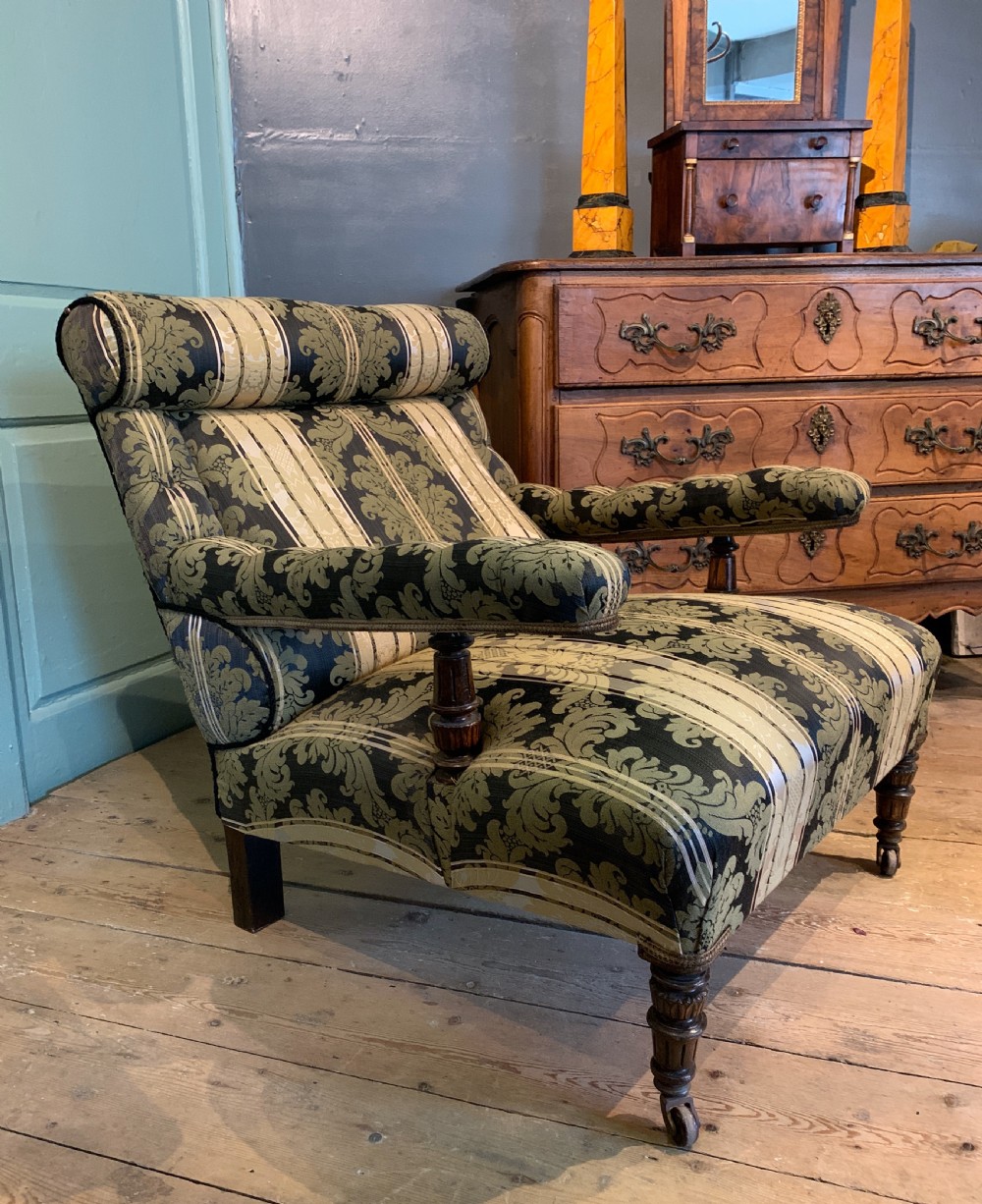 Victorian deep seated armchair newly upholstered in damask