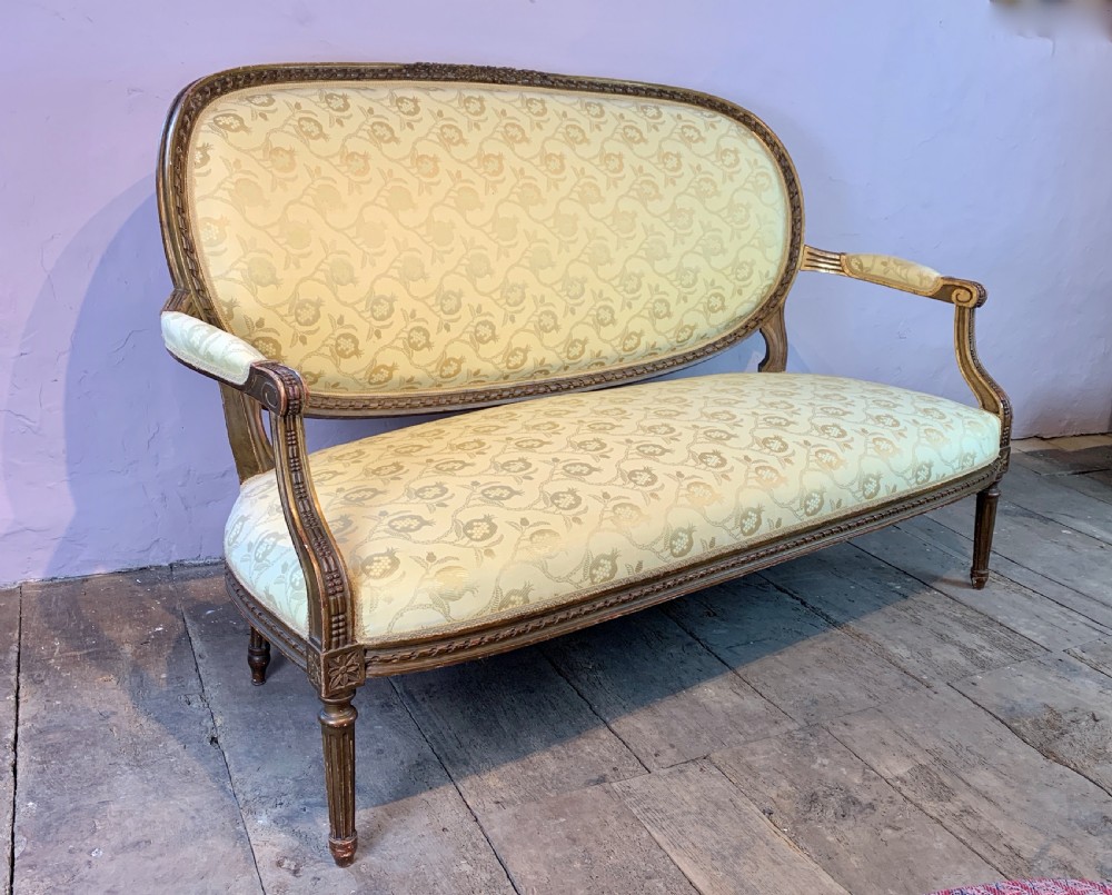 Antique French Louis XVI revival giltwood sofa