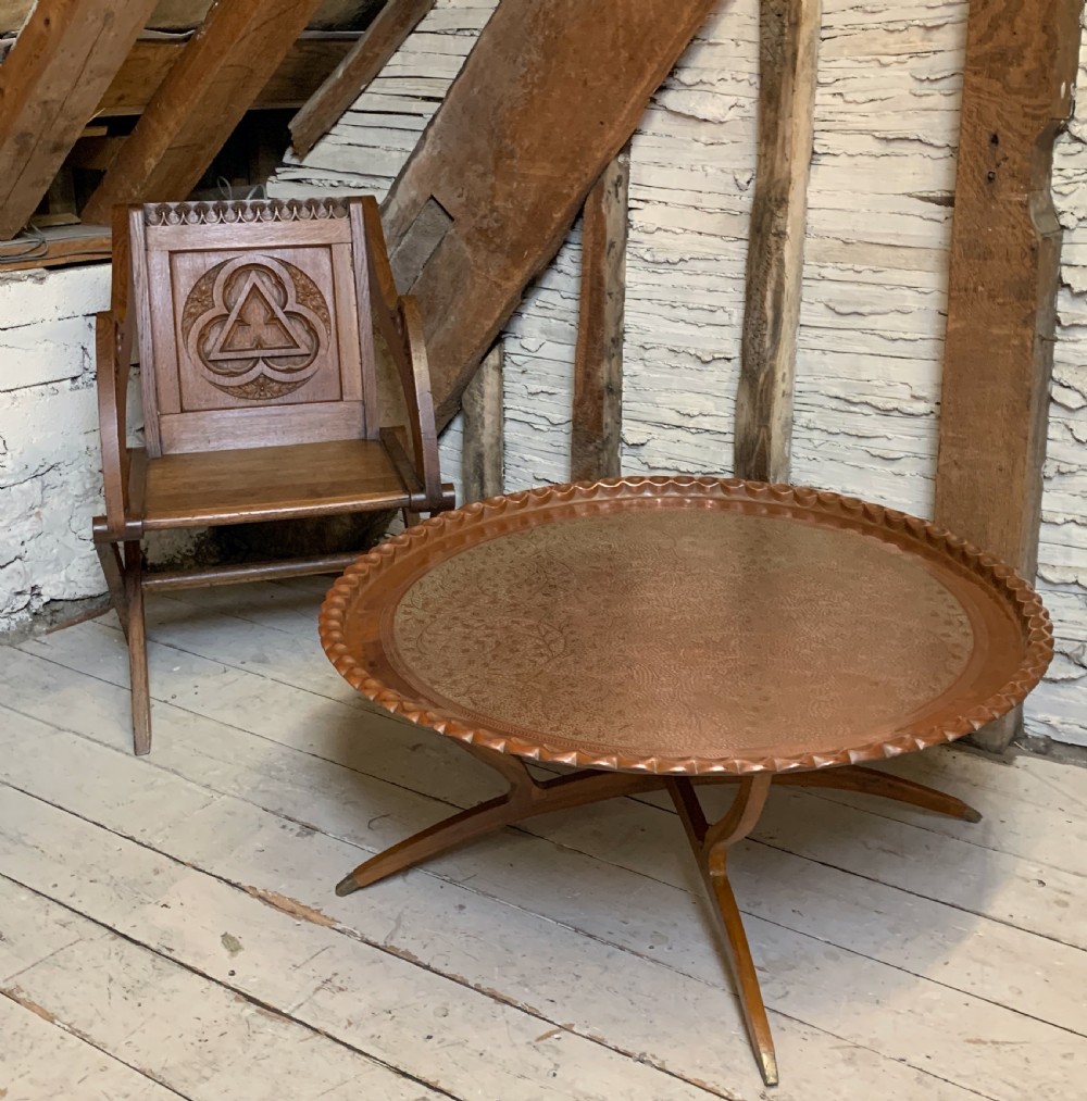 Huge Indian engraved copper tray table upon folding stand View II