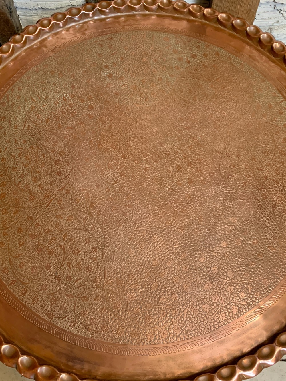 Huge Indian engraved copper tray table upon folding stand View III