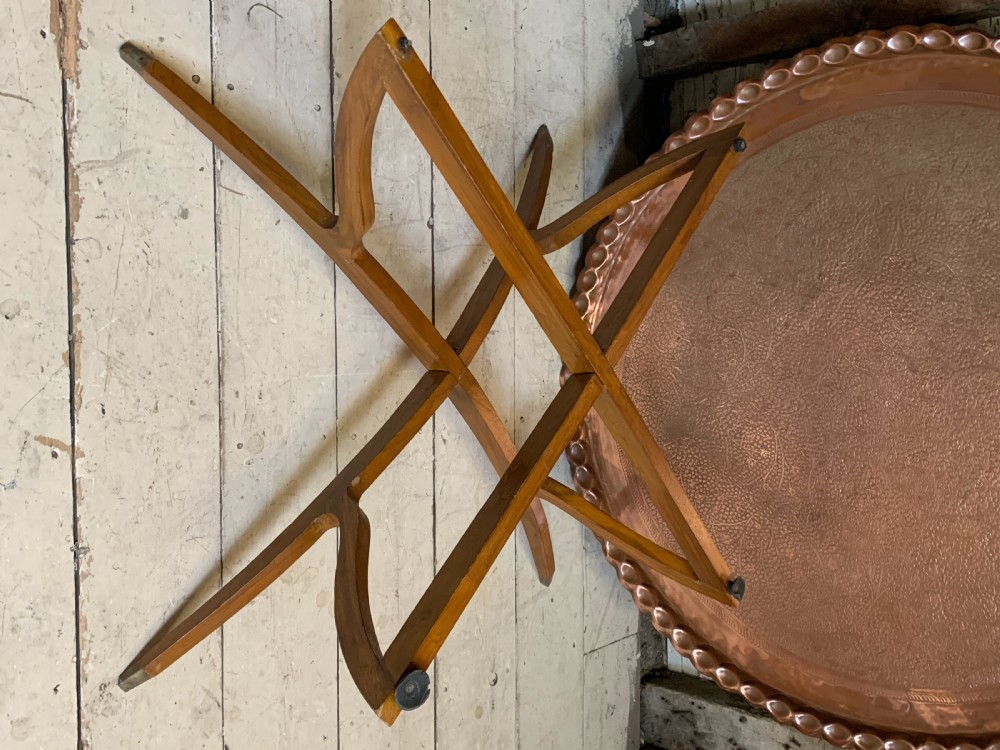 Huge Indian engraved copper tray table upon folding stand View IV
