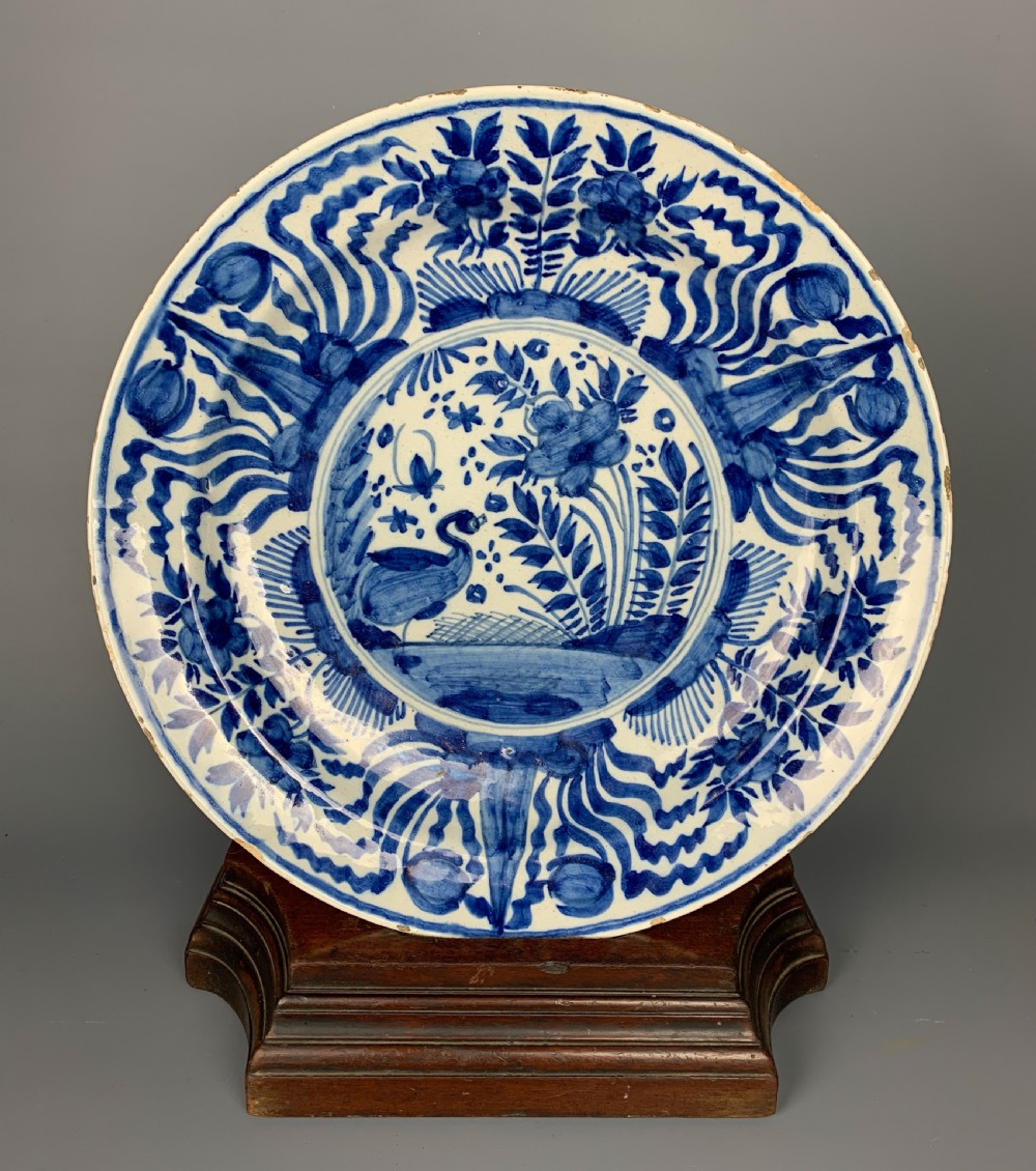 18th century Delft blue & white charger painted with tulips and a water bird