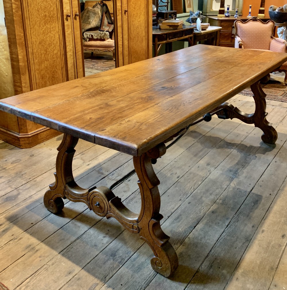 Spanish oak refectory dining table with iron stretchers View III