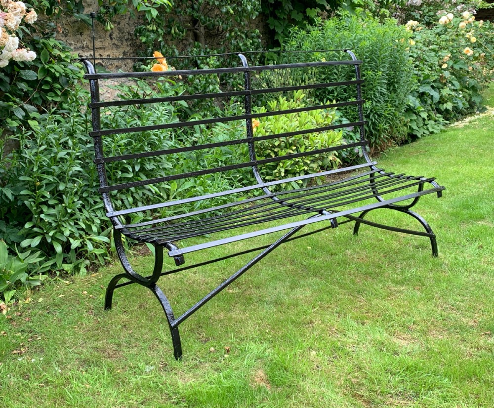 Edwardian wrought iron strap-work garden bench