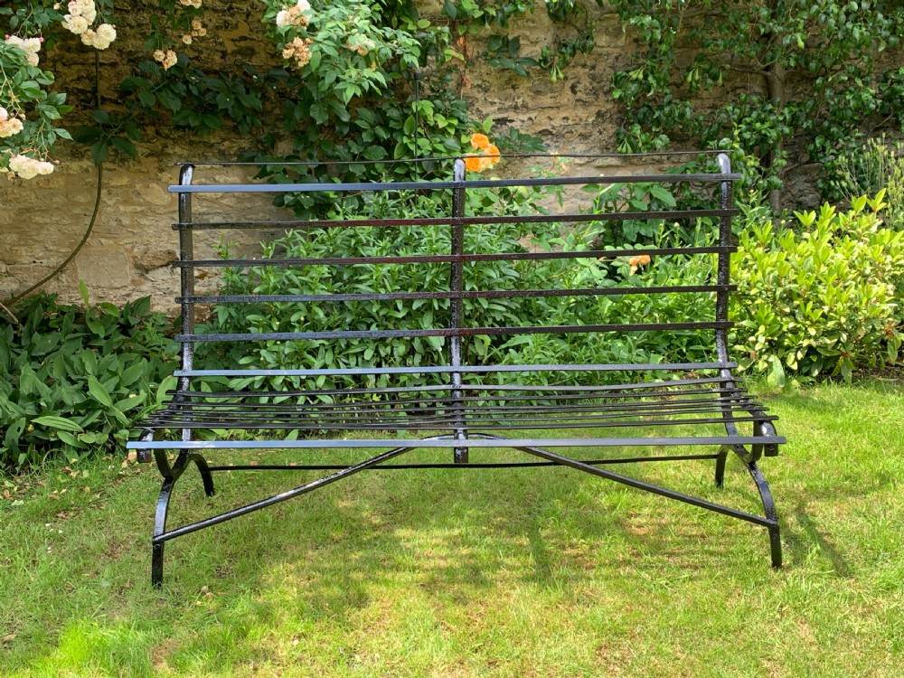 Edwardian wrought iron strap-work garden bench View IV