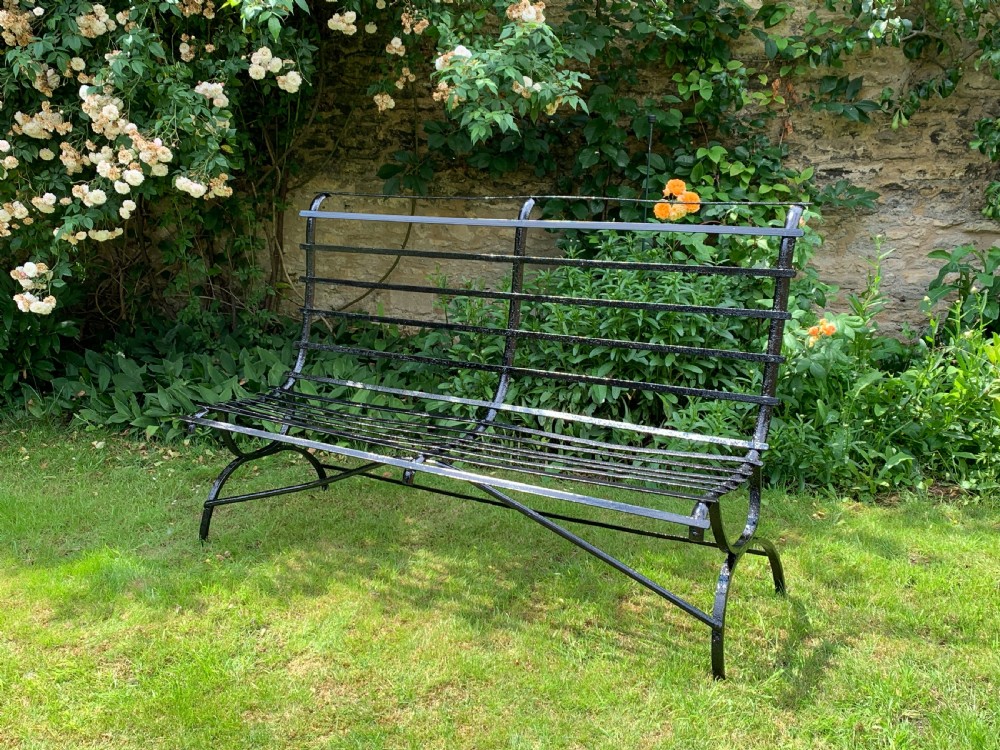 Edwardian wrought iron strap-work garden bench View VI