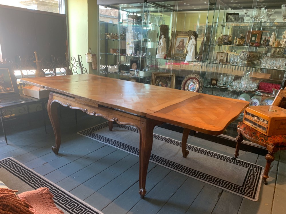 French marquetry walnut draw-leaf dining table in Louis XV style View II